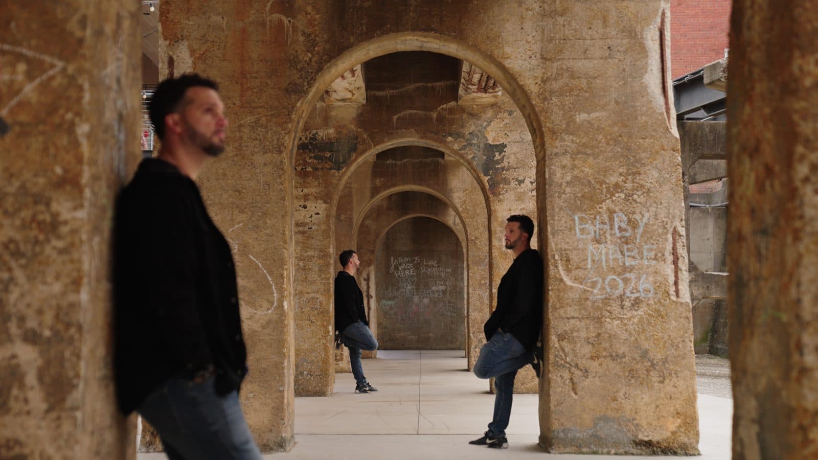 Environmental brand portrait shot under the historic arches in downtown Winston-Salem